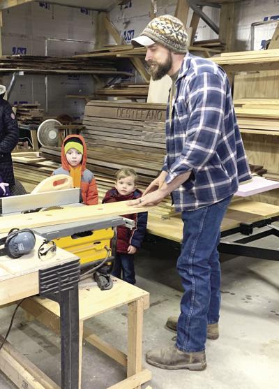 Steve DeStefano displays woodworking skills to the Pre-Kindergarten classes of Wells Elementary School in Grayville.