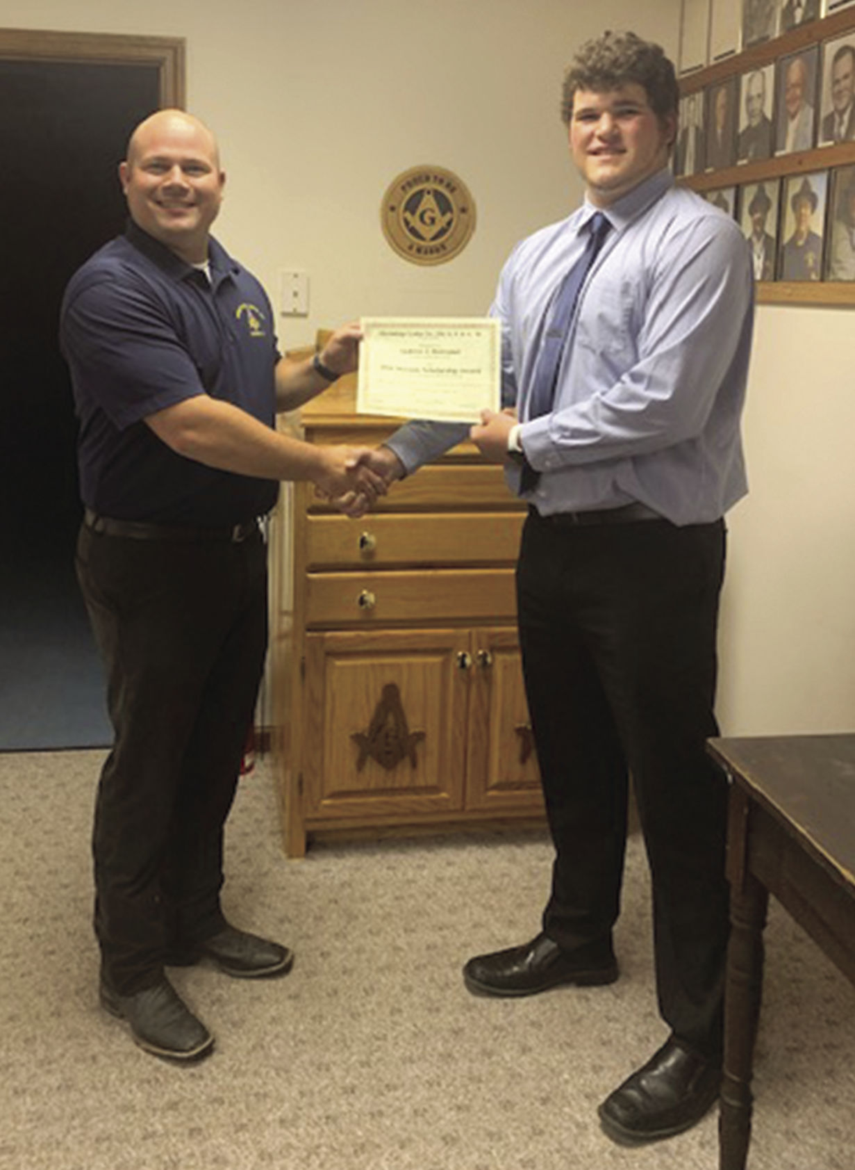 Judd Longbons from Hermitage Lodge #356 presents scholarships