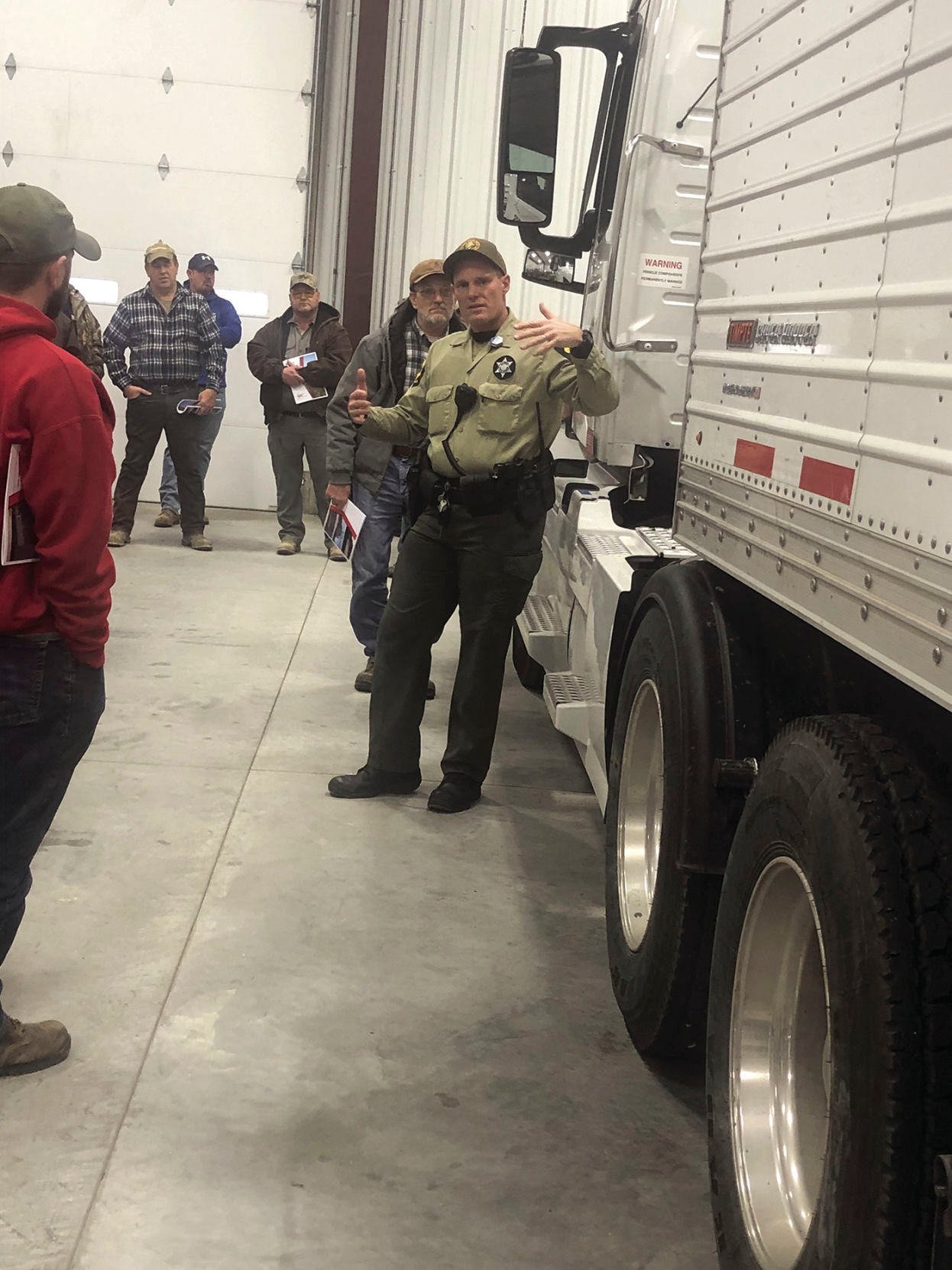 Illinois State Police Trooper inspects truck